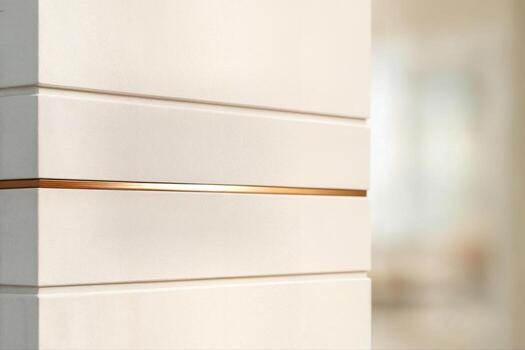 Bronze Band In Minimalist Architectural Setting With Closeup Focus On Textured Surface And Soft Background Blur Creating An Elegant Composition photo