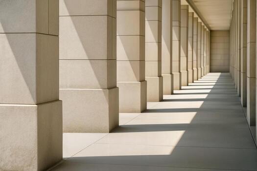 Colonnade Under Bright Sunlight Creating Geometric Patterns of Light and Shadow in an Architectural Setting With Strong Architectural Lines and Receding Perspective photo