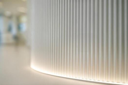 Contemporary Interior Featuring a Ribbed Wall Design With Soft Lighting and Minimalist Aesthetic, Captured Indoors With Shallow Depth Of Field photo
