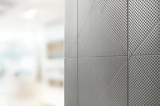 Diamond Patterned Rainscreen Panel Indoors Highlighting Perforated Metal Design With Shallow Depth Of Field And A Blurred Background photo