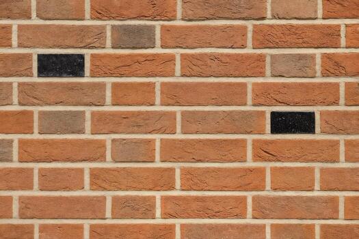 Glazed Brickwork On An Exterior Wall Highlighted By Sunlight Creating A Sparkle Effect With A Variety Of Brick Textures And Shades In An Urban Environment photo