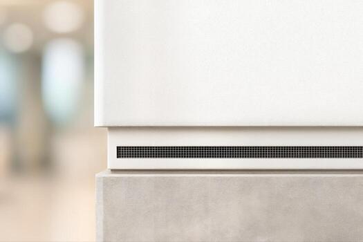 Sleek Modern Plinth in a Minimalist Indoor Setting with a Blurred Background and Shallow Depth of Field Creating a Clean, Elegant Atmosphere photo