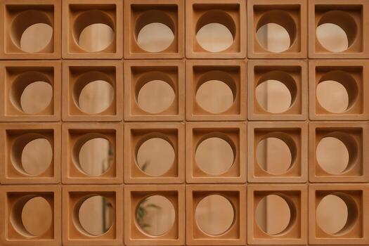 Terracotta Screen Design Featuring Repetitive Geometric Patterns in a Grid Arrangement in a Minimalist Style With Shallow Depth of Field photo