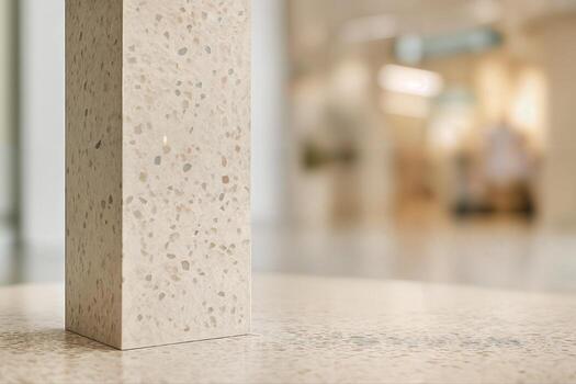 Terrazzo Column in an Indoor Setting Featuring a Polished Surface and Subtle Patterning, With a Slightly Blurred Background Enhancing Its Elegant Design photo
