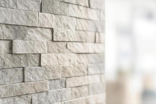Textured Stone Wall In A Modern Interior Featuring A Closeup View Of Interlocking Stone Pattern With Natural Light Creating A Subtle And Neutral Atmosphere photo