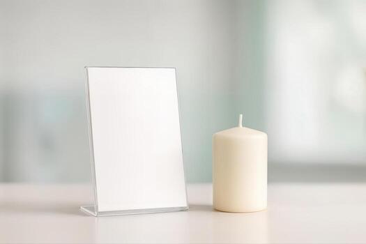 Mock-up of a blank Minimalist Candle Display Featuring a Single White Candle Next to a Simple Clear Acrylic Sign Inside a Bright Indoor Space With a Soft, Neutral Background photo