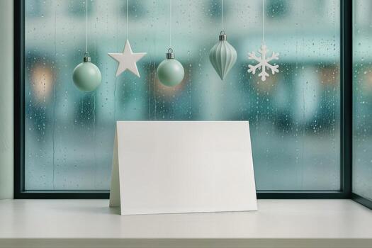 Blank Table Tent Card On A Store Counter Anchored By Hanging Holiday Ornaments, Framed Against A Rainy Window, Ideal For Seasonal Retail Promotions With Shallow Depth Of Field photo