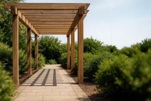 Wooden Pergola Casting Shadows on a Sunny Pathway in a Lush Garden Setting With Clear Skies and Natural Light Highlighted photo
