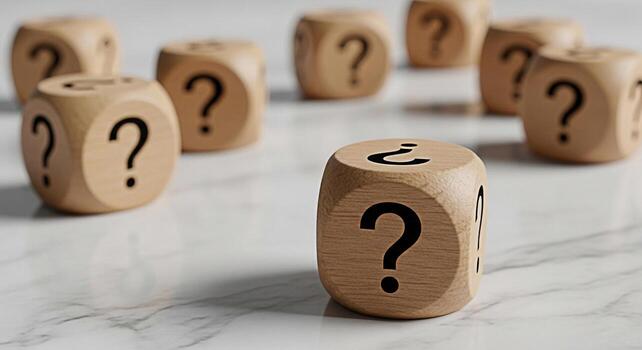 Wooden dice displaying question marks on a marble surface representing uncertainty and the search for answers in a complex problemsolving scenario creating a mood of curiosity and intellectual challen photo