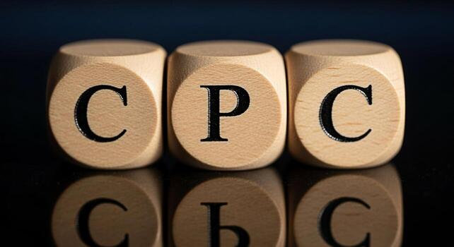 Three wooden blocks displaying CPC on a reflective black surface representing cost per click advertising in a digital marketing strategy conveying precision and financial awareness in online campaigns photo