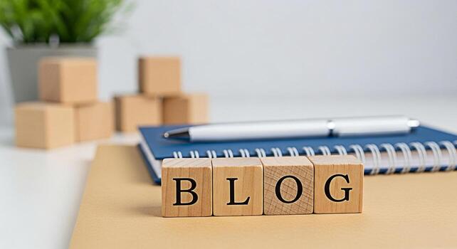 Wooden blocks spelling BLOG rest on a notebook in a bright minimalist workspace symbolizing creative writing online content creation and the sharing of ideas in a modern professional setting photo