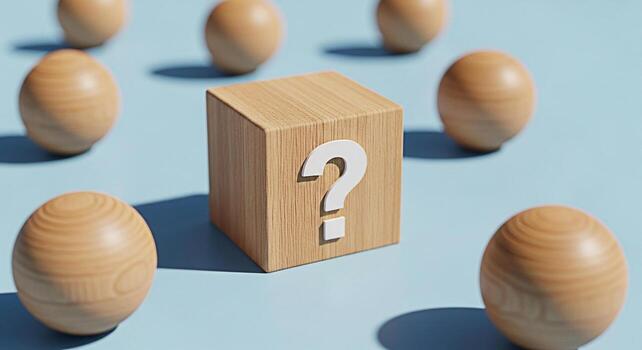 Wooden cube displays a question mark surrounded by wooden spheres on a light blue surface symbolizing uncertainty curiosity and the search for answers in a minimalist and conceptual composition photo