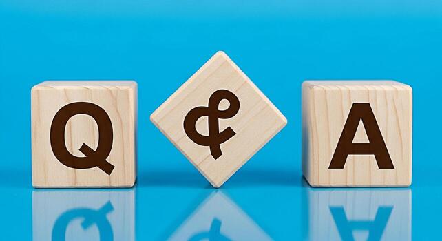 Wooden blocks displaying Q A on a vibrant blue surface representing questions and answers knowledge sharing and interactive learning in a modern and engaging environment photo