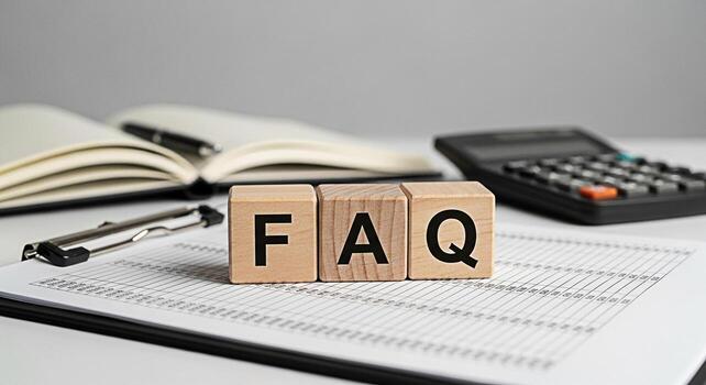 Wooden blocks spelling FAQ on a clipboard in a bright office representing frequently asked questions and information resources for customers and clients promoting clarity and assistance photo