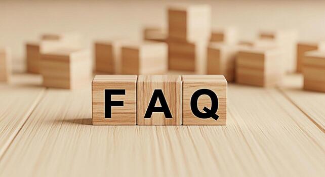 Wooden blocks displaying FAQ on a light wooden surface representing frequently asked questions and information resources conveying a sense of clarity and helpfulness in a business setting photo