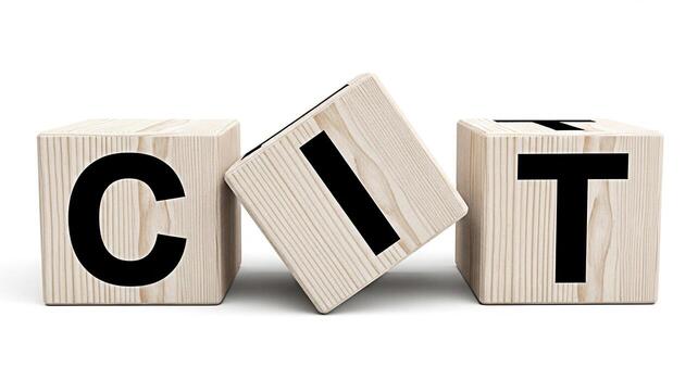 Wooden blocks spelling CIT on a white surface representing technology and innovation conveying a sense of creativity learning and modern solutions in a clean and minimalist setting photo