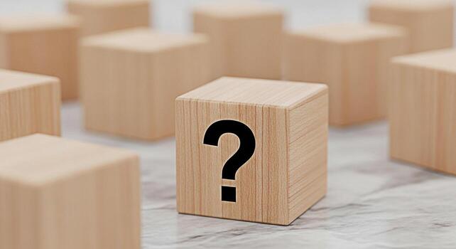 Wooden block displaying a question mark on a marble surface surrounded by other blocks symbolizing uncertainty and the search for answers in a minimalist and thoughtprovoking setting photo