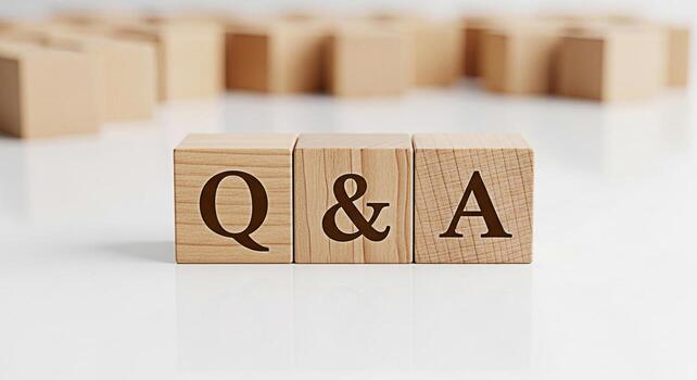 Wooden blocks displaying QA on a white surface representing a question and answer session symbolizing knowledge sharing and problemsolving in a clean and minimalist setting fostering a sense of clarit photo