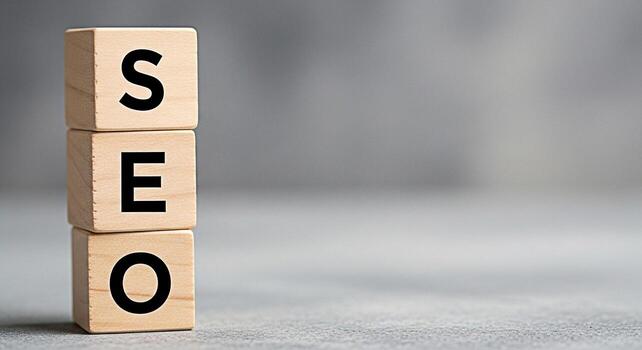 Stacked wooden blocks spelling SEO in a minimalist studio setting representing search engine optimization and the importance of online visibility for business growth and success in the digital marketi photo