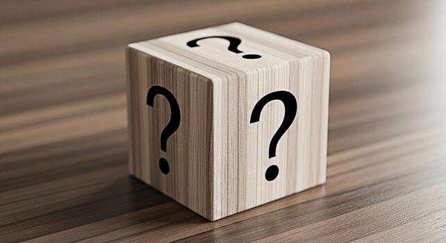 Wooden cube displaying question marks on a wooden surface symbolizing uncertainty mystery and the need for answers in a business or personal context creating a mood of curiosity and intrigue photo