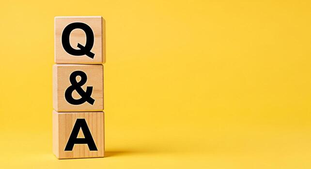 Wooden blocks displaying Q A stacked against a vibrant yellow backdrop symbolizing knowledge sharing and problemsolving in a bright and engaging learning environment fostering curiosity and understand photo