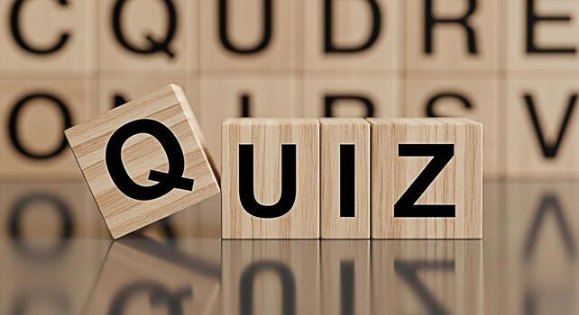 Wooden blocks spelling QUIZ on a reflective surface with blurred letter blocks in the background creating a playful and engaging atmosphere for educational content and knowledge testing photo