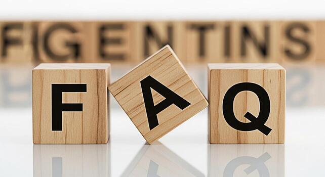 Wooden blocks spelling FAQ on a white reflective surface representing frequently asked questions and providing answers creating a sense of clarity and support for customers and users seeking informati photo