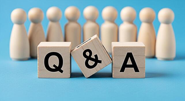 Wooden figures standing behind wooden blocks displaying Q A on a blue background representing a question and answer session fostering a collaborative and informative environment promoting knowledge sh photo
