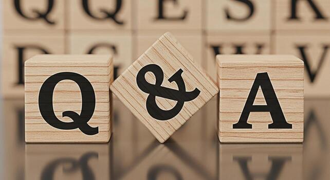 Wooden blocks displaying Q A on a reflective surface symbolizing knowledge and information exchange in a learning environment creating a mood of curiosity and problemsolving photo