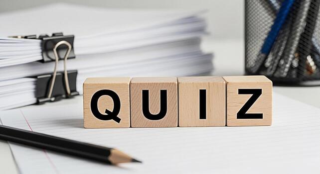 Wooden blocks spelling QUIZ on a white desk with papers and pencil representing a test or assessment in an educational or business setting creating a feeling of challenge and knowledge photo