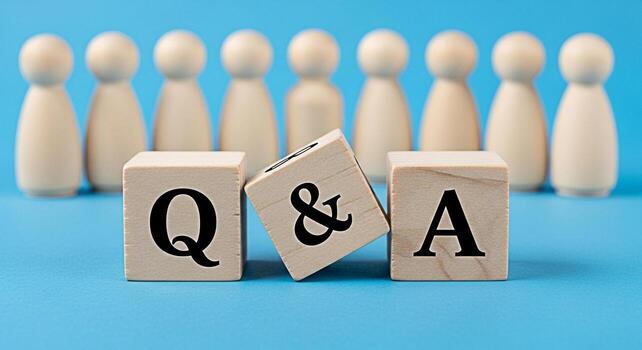 Wooden blocks displaying Q A in front of a group of wooden figures on a blue background representing questions and answers knowledge sharing and community engagement in a simple and clean setting photo