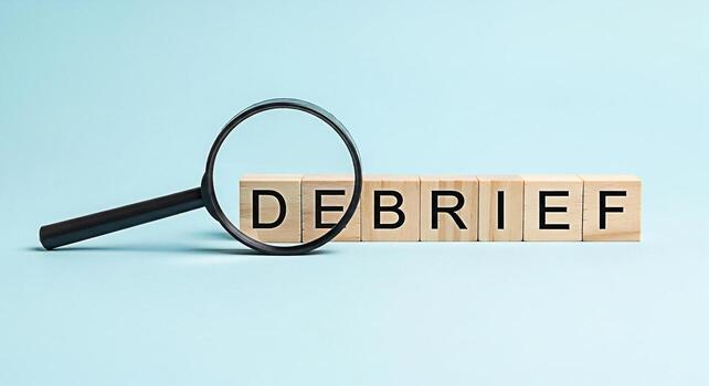 Magnifying glass examining wooden blocks spelling debrief on a light blue background representing analysis and review creating a focused and investigative atmosphere for business and project evaluatio photo