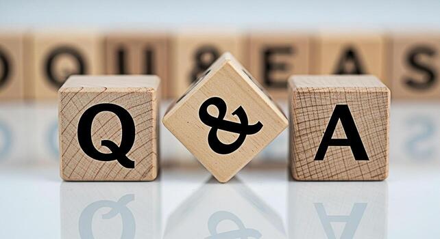 Wooden blocks spelling out Q A on a reflective surface symbolizing questions and answers in a bright and clean environment representing knowledge and information exchange photo