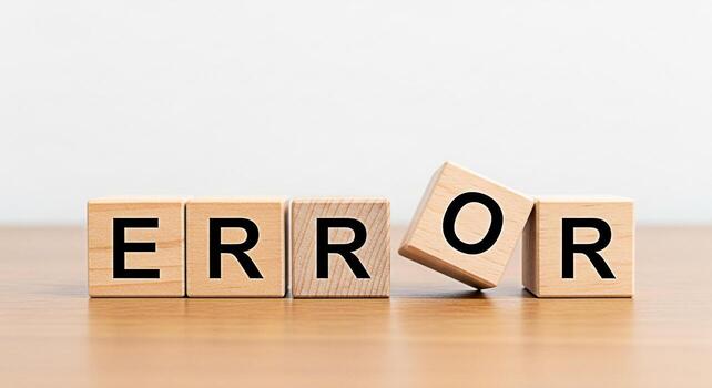 Wooden blocks spelling ERROR on a wooden surface with one block tilting symbolizing a system failure technical problem or website malfunction conveying a sense of frustration and the need for troubles photo