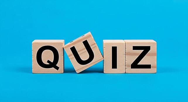 Wooden blocks spelling QUIZ on a blue background inviting participation and testing knowledge in an educational and engaging environment promoting learning and intellectual stimulation photo