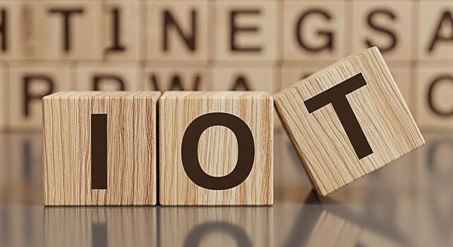 Wooden blocks spelling IOT in a conceptual arrangement representing the Internet of Things in a modern interconnected world showcasing innovation and technological advancement photo