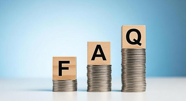 Wooden blocks displaying FAQ on stacks of coins in a bright studio setting representing financial questions and answers investment knowledge and the concept of frequently asked questions about money m photo