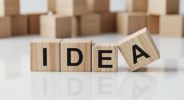 Wooden blocks spelling IDEA on a white surface symbolizing creative thinking and problemsolving in a minimalist setting conveying innovation and inspiration for business and personal growth photo