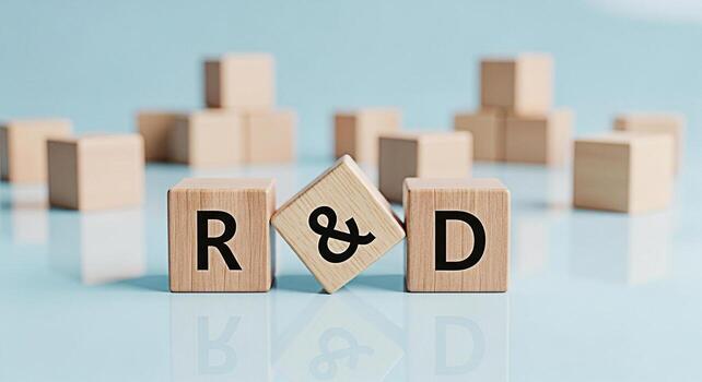 Wooden blocks displaying RD on a reflective blue surface symbolizing research and development innovation and strategic planning for business growth and technological advancement in a modern setting photo