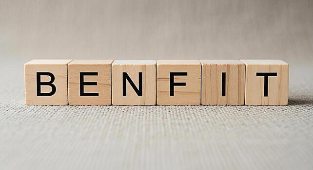 Wooden blocks spelling out BENEFIT on a neutral surface symbolizing advantages and positive outcomes conveying a message of value and gain in a simple yet impactful way photo
