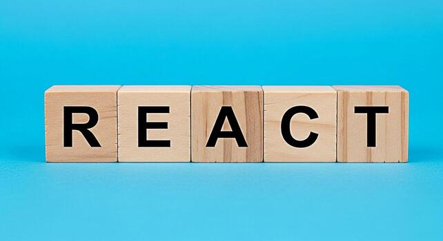 de madera bloques ortografía reaccionar en un vibrante azul superficie simbolizando un dinámica y atractivo marco de referencia para web desarrollo y usuario interfaz diseño Fomentando innovación y creatividad en el digital spa foto