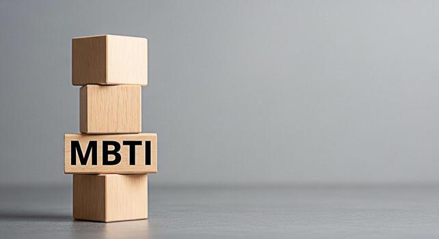 Wooden blocks displaying MBTI in a simple studio setting representing personality assessment and psychological types conveying a sense of understanding and selfdiscovery ideal for career guidance and photo