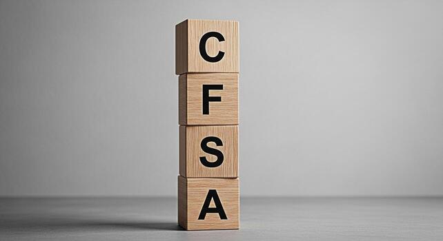 Wooden blocks displaying CFSA in a minimalist studio setting symbolizing financial planning investment strategies and professional certification for financial advisors conveying trust and expertise photo