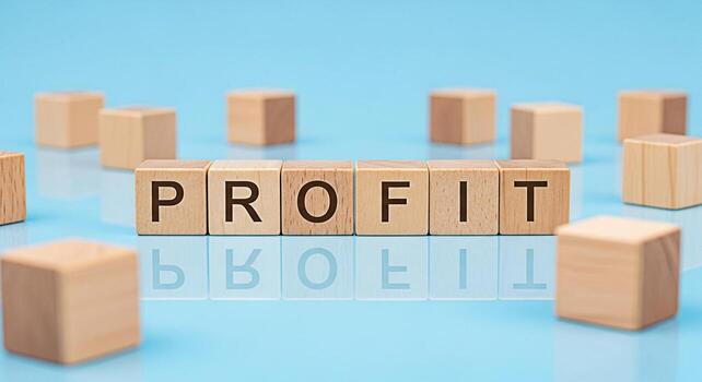 de madera bloques ortografía lucro en un azul reflexivo superficie rodeado por otro bloques simbolizando financiero éxito y negocio crecimiento creando un positivo y optimista atmósfera para inversión foto