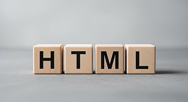 Wooden blocks spelling HTML on a gray surface representing web development coding and the fundamental building blocks of website creation in a minimalist and clean studio setting photo