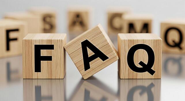 Wooden blocks displaying FAQ on a reflective surface representing information and assistance creating a clear and helpful atmosphere for customer service and problemsolving conveying a sense of suppor photo