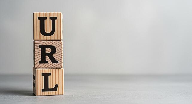Wooden blocks spelling URL stacked on a gray surface representing the importance of website addresses and online presence in a digital environment conveying a message of web accessibility and internet photo