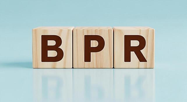 Wooden blocks displaying the letters BPR on a light blue surface representing Business Process Reengineering in a clean and minimalist environment symbolizing efficiency and optimization photo