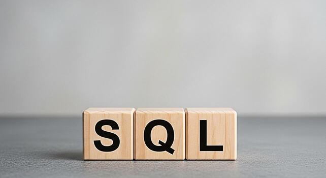 Wooden blocks displaying SQL on a gray surface representing database management and data querying in a clean and minimalist setting conveying a message of structured information and technology photo