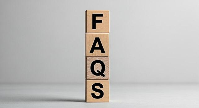 Wooden blocks spelling FAQs stacked vertically in a bright studio setting representing information assistance and customer service for online businesses and ecommerce platforms photo